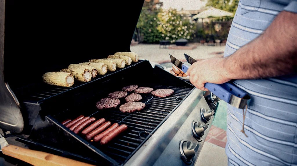 shot of man barbecuing meat